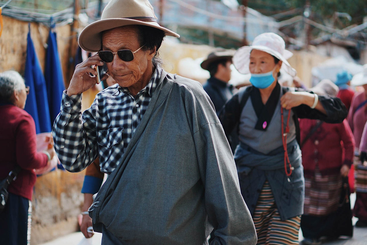 A man walking and talking on his phone.